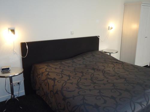 Кровать или кровати в номере Hotel Café Restaurant De Posthoorn