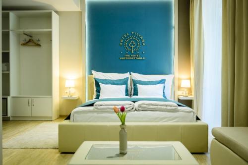 A bed or beds in a room at The Hotel Unforgettable - Hotel Tiliana by Homoky Hotels & Spa
