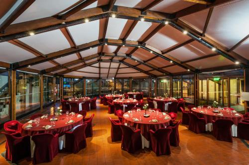 a large room with tables and chairs in it at Hotel de la Cañada in Córdoba