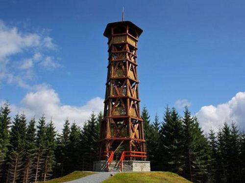 a tall tower sitting on top of a hill at Apartment WELLNESS Vlčková in Vlčková