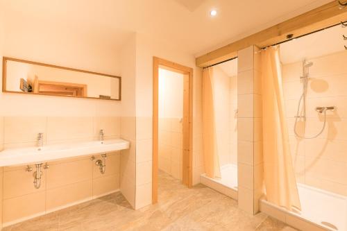 a bathroom with a sink and a shower at Balbach Alm Apartment in Oetz