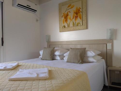 Ένα ή περισσότερα κρεβάτια σε δωμάτιο στο Brava Apart Hotel
