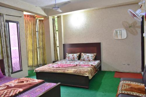 a bedroom with a bed in a room at Lahore Hotel in Swat