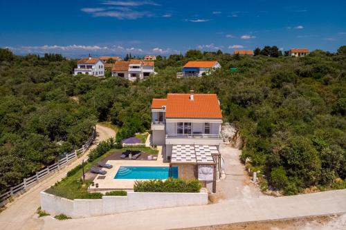 an aerial view of a house with a swimming pool at Villa Gellia in Ugljan