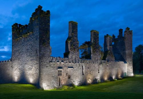 an image of a castle at night at Castlemartyr Resort Hotel in Castlemartyr