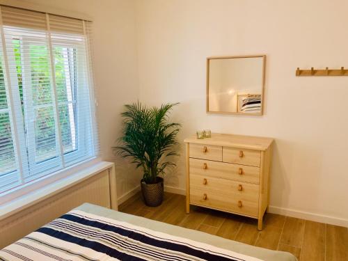 Un pat sau paturi într-o cameră la Residentie Lenthe