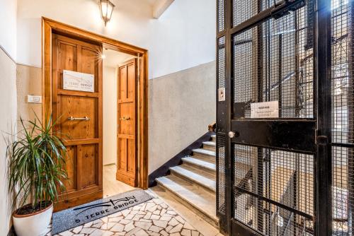 an open door to a room with a staircase at Cinque Terre Bridge in La Spezia