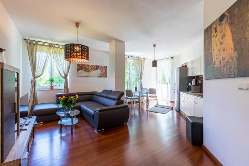 Телевизор и/или развлекательный центр в Rezidence Moser Apartments