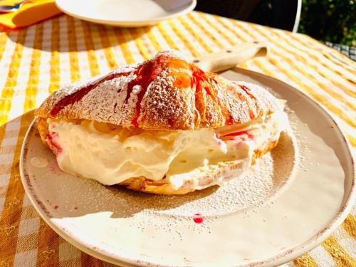 a sandwich on a plate on a table at Tenuta Colverano in Montefalco