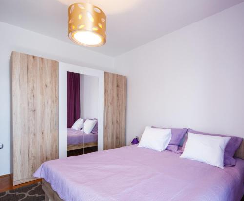 Posteľ alebo postele v izbe v ubytovaní APARTMAN VIDA