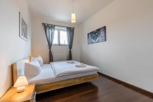 Кровать или кровати в номере Rezidence Moser Apartments