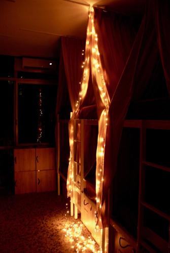 a room with a bed with lights on it at Acropolis View Dream in Athens