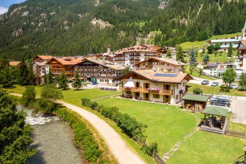 an aerial view of a resort in the mountains at Appartamenti Cleva Canazei Dolomiti in Canazei
