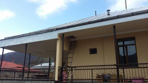 a building with a staircase on the side of it at Verishen Guest House B&B in Goris