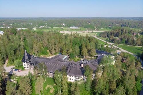 an aerial view of a large house in the woods at Majvik Congress Hotel in Kirkkonummi