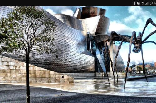 a large building with a spider sculpture in front of it at LAIA HOME GARAJE Y WIFI in Barakaldo
