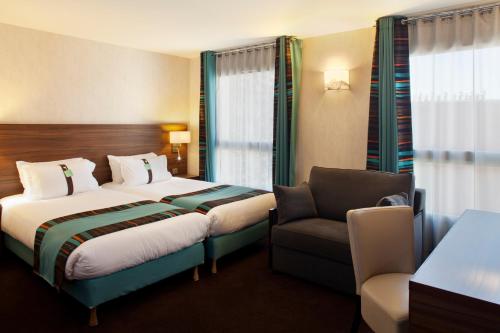Postel nebo postele na pokoji v ubytování Holiday Inn Paris Montmartre by IHG