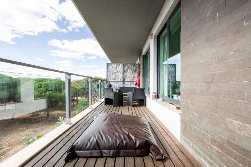 a bedroom on the deck of a house at Golf Residence Apartment in Vilamoura