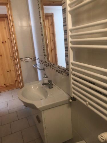 a bathroom with a sink and a mirror at Villa Jobè in Polignano a Mare
