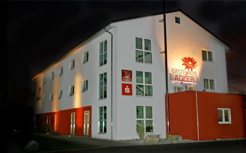 a building with a sign on the side of it at Gästehaus Adler in Biberach an der Riß