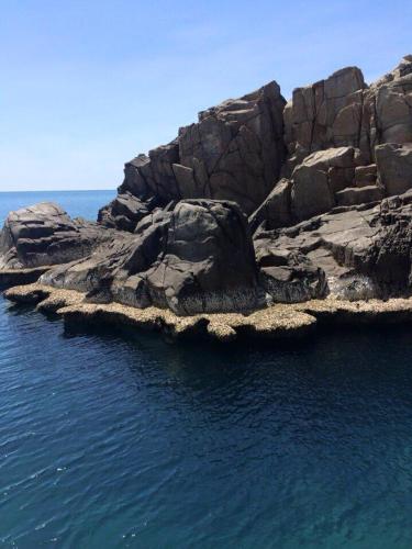 an island in the middle of the water at Hotel Hương Đào in Con Dao