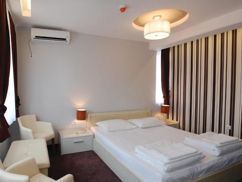 Postel nebo postele na pokoji v ubytování Holiday Park CFK