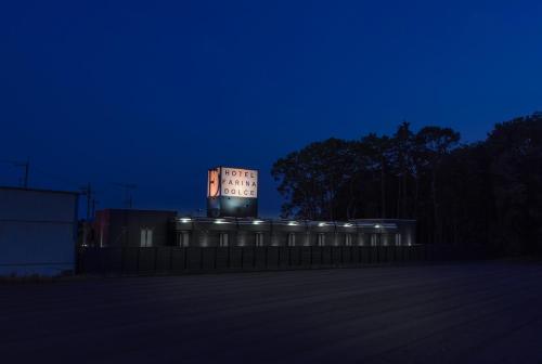 a lit up building on top of a building at night at HOTEL FARINA DOLCE (Adult Only) in Kanuma