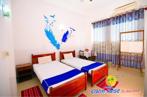 Кровать или кровати в номере Owin Rose Yala Safari Hotel