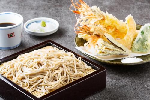 a tray of noodles and a plate of food at BEB5 Karuizawa by Hoshino Resorts in Karuizawa