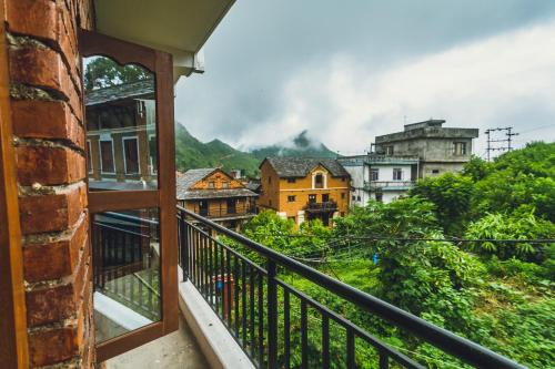 a balcony with a view of a city at Shristi Hotel & Lodge in Bandīpur