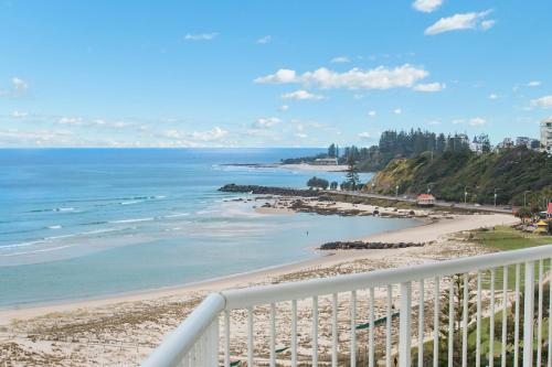 a view of the beach from a balcony at Meridian Tower Kirra Beach in Gold Coast