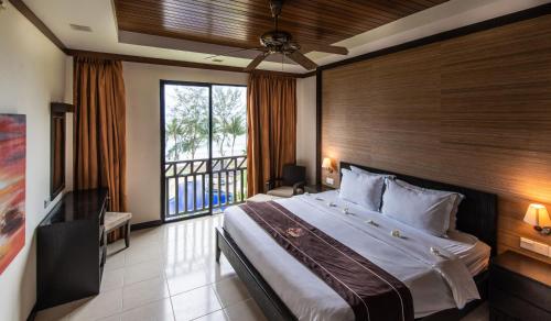 Letto o letti in una camera di Sabah Beach Villas & Suites