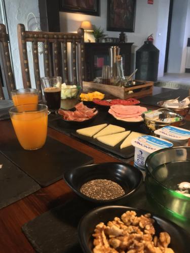 a table with a bunch of food and drinks on it at LA BENDITA LOCURA in El Puerto de Santa María
