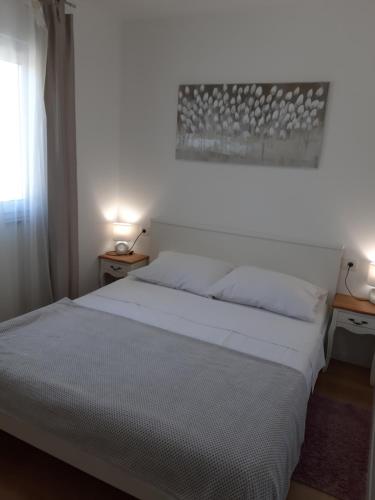Ένα ή περισσότερα κρεβάτια σε δωμάτιο στο Apartment Gita