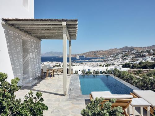 a view of a villa with a swimming pool at Belvedere Mykonos - Hilltop Rooms & Suites - The Leading Hotels of the World in Mýkonos City