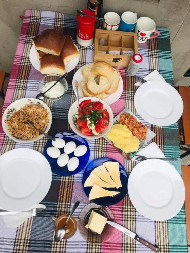 a table with plates of food on top of it at happy pandasN12 in Borjomi