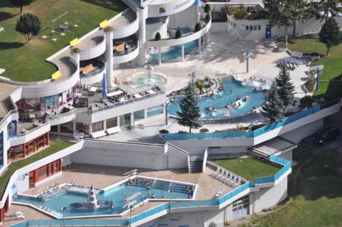 an aerial view of a building with a swimming pool at GOLIATH in Leukerbad