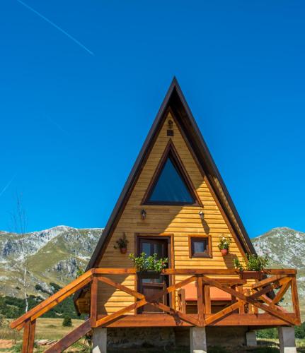 a tiny house with a steep pitched roof at Etno selo Smrčevo brdo in Žabljak