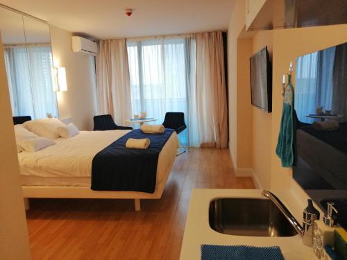 Postel nebo postele na pokoji v ubytování ORBi CITY TOWERS