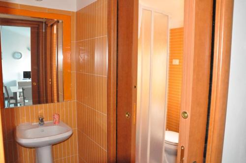 a bathroom with a sink and a mirror at Case Vacanze Residence Trinacria in Acireale