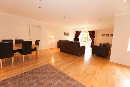 a living room with a table and chairs at Assaroe Falls in Ballyshannon