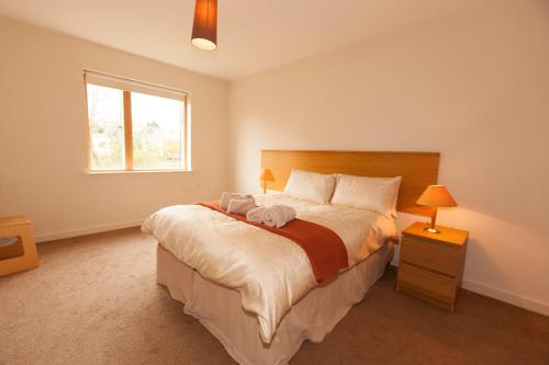 a bedroom with a large bed and a window at Assaroe Falls in Ballyshannon