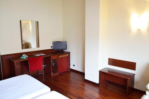 Ένα ή περισσότερα κρεβάτια σε δωμάτιο στο Hotel Alda El Suizo