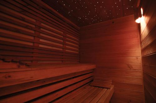 an empty wooden sauna with wooden floors and walls at La Petite France in San José de Maipo