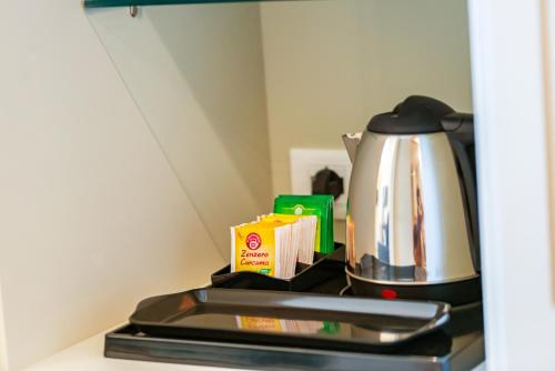 a tea kettle sitting on top of a stove at Hotel Politeama in Palermo