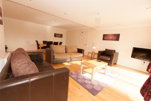 a living room with a couch and a table at Assaroe Falls in Ballyshannon