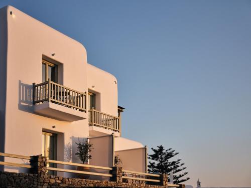 a building with balconies on the side of it at Belvedere Mykonos - Hilltop Rooms & Suites - The Leading Hotels of the World in Mýkonos City