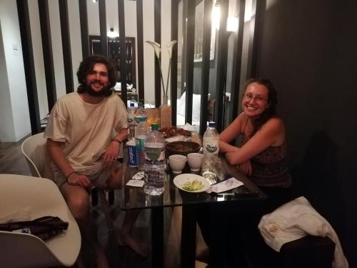 a man and a woman sitting at a table at Eden Studio Apartments - 1 in Colombo