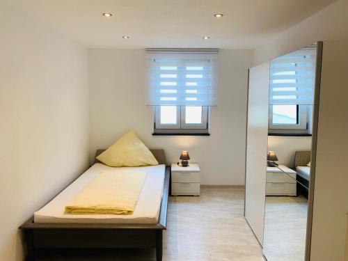 Postel nebo postele na pokoji v ubytování Ferienwohnung Mentes