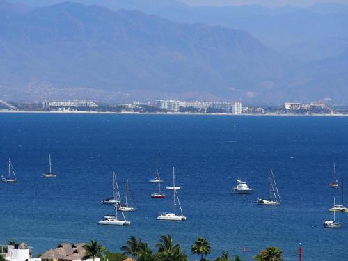 a group of boats in a large body of water at Quinta del Encanto in Cruz de Huanacaxtle